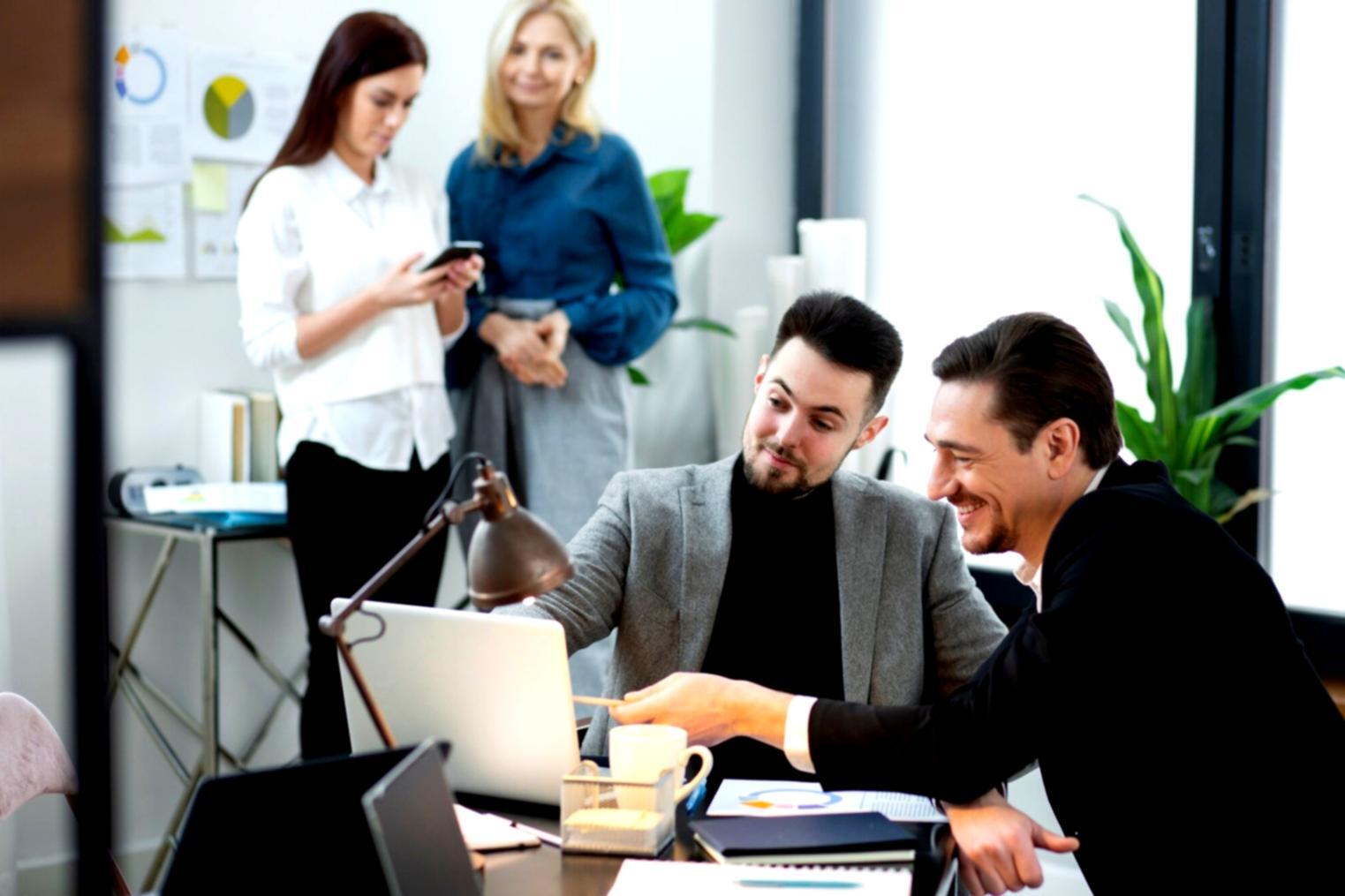 Students working with trading platforms and market data during evening class session